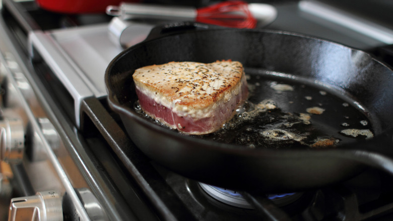 cast iron skillet on gas stove