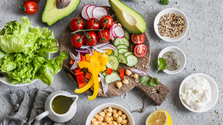 Fresh vegetables and toppings for making a salad