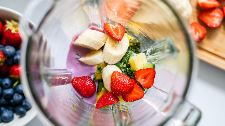 Top view of blender with smoothie ingredients