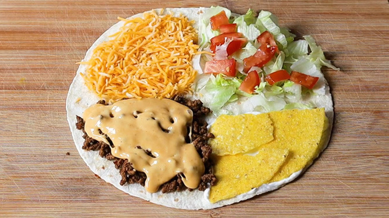 Tortilla crunchwrap sections with cheese, meat, chips