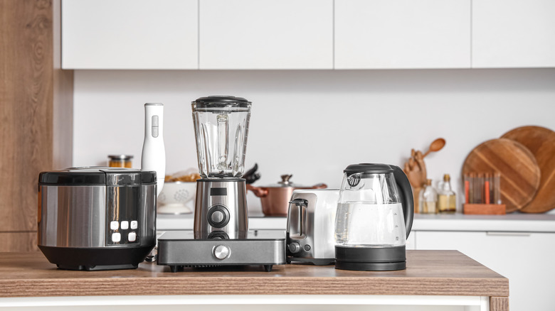 Kitchen appliances cover a wooden countertop