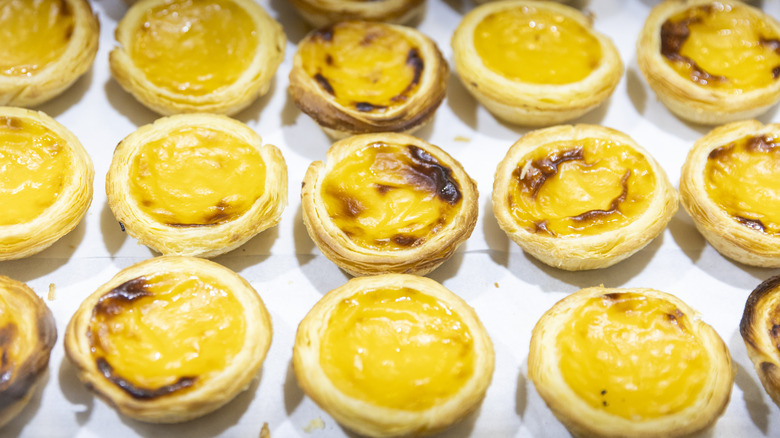 Rows of small egg tarts