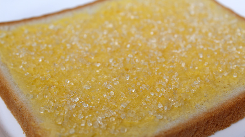 White bread with butter and sugar on top