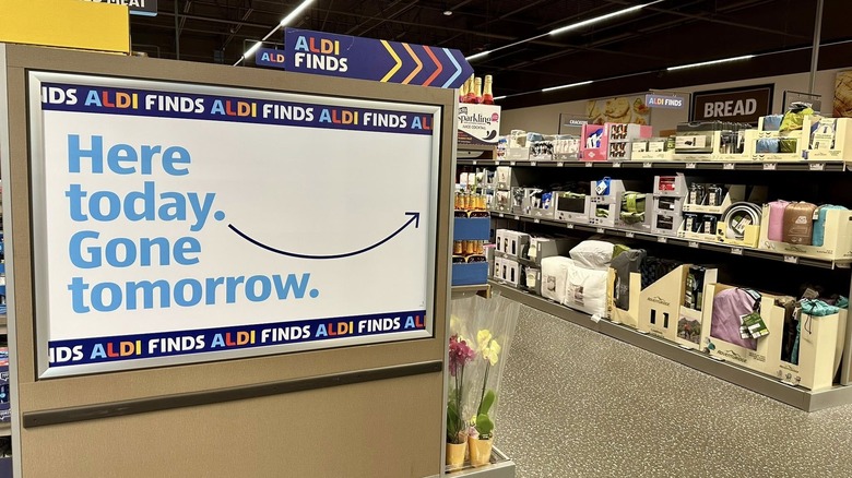 An Aldi Finds aisle endcap reveals a sign.