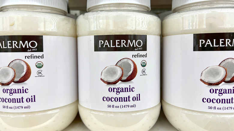 Jars of organic refined coconut oil on a supermarket shelf