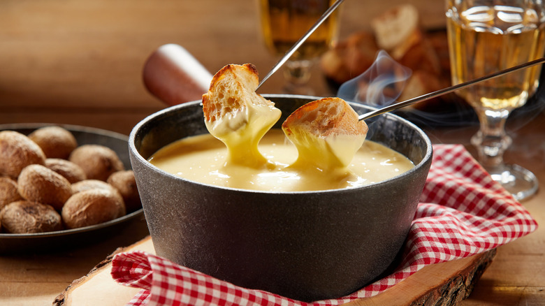 baguette bread dipped in fondue