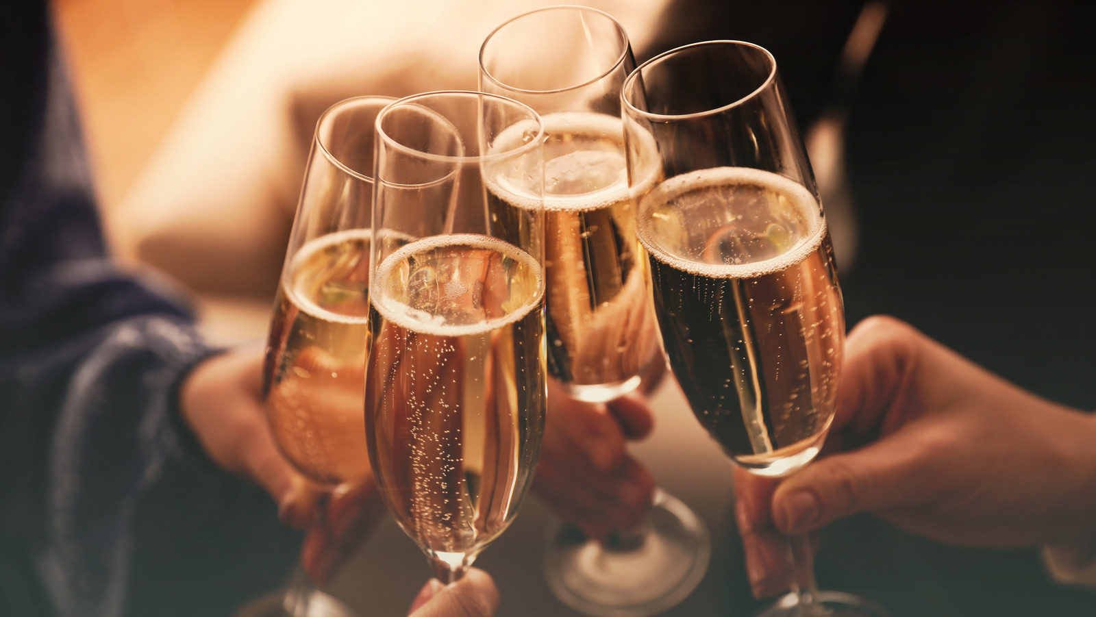 The Historical Reason We Pop Champagne Bottles On New Year's Eve