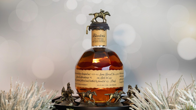A Blanton's bourbon bottle with a horse and jockey topper.