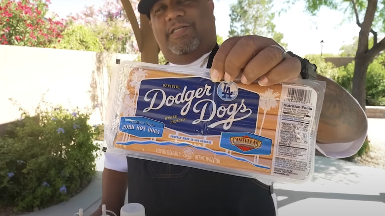 YouTuber holding package of Cantella's Dodger Dogs