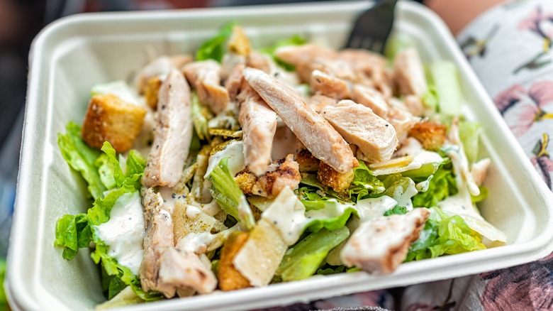 Chicken Caesar salad square takeout bowl