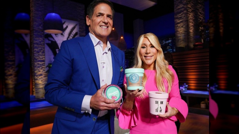 Cuban and Greiner holding ice cream canteens on Shark Tank set
