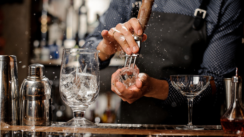 Bartender crushing ice