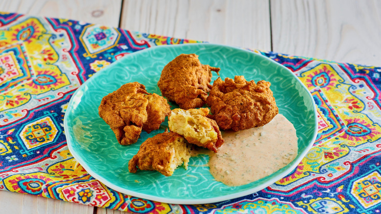 conch fritters served on plate with remoulade sauce