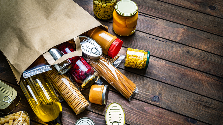 paper bag spilling over with grocery items