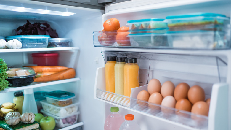 Open refrigerator full of food
