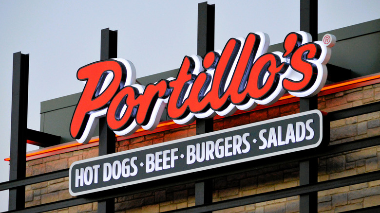 A Portillo's restaurant front with a red sign