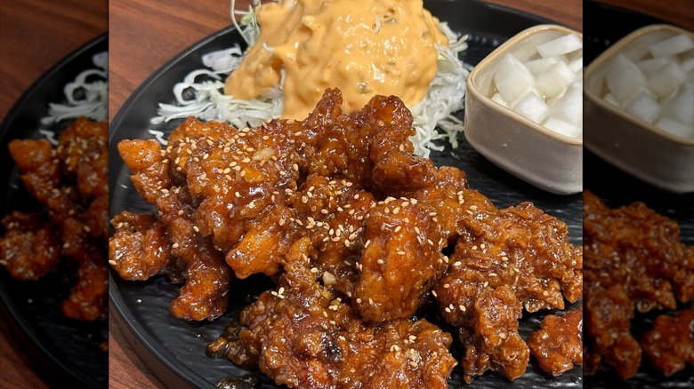 Plate of Asian food from Saraga International food court