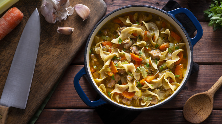 Dutch oven with noodle soup inside