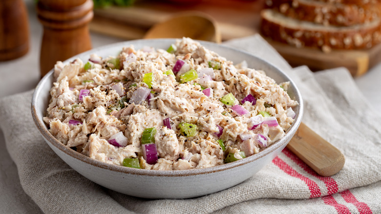 Bowl of fresh tuna salad with bits of celery and red onion