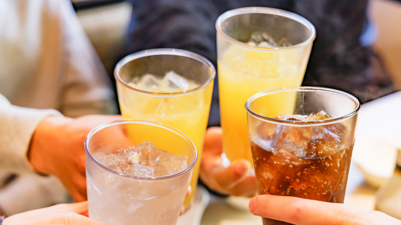 Diners cheering drinks at a restaurant.