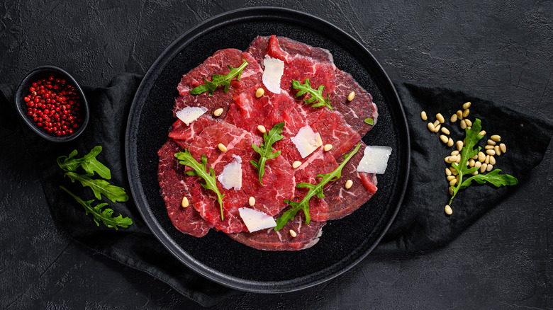 Carpaccio with cheese and arugala