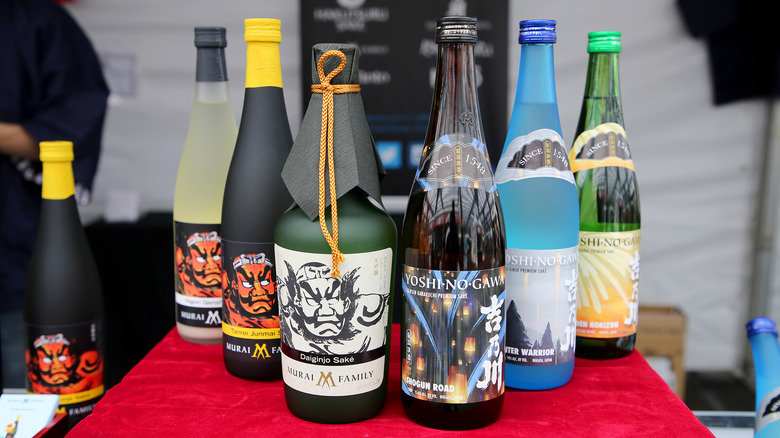 Bottles of sake on red table