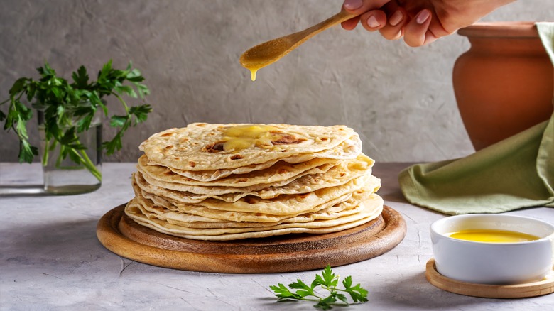 A stack of rotis with ghee