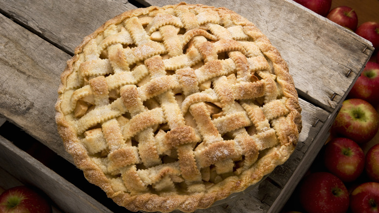 lattice top apple pie on wooden apple crate