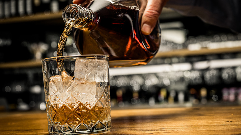 whiskey poured into a glass