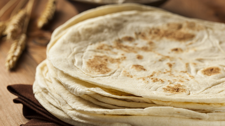 stack of homemade flour tortillas on display