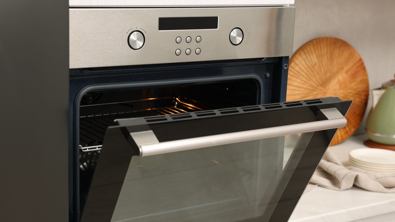 Open electric oven in kitchen