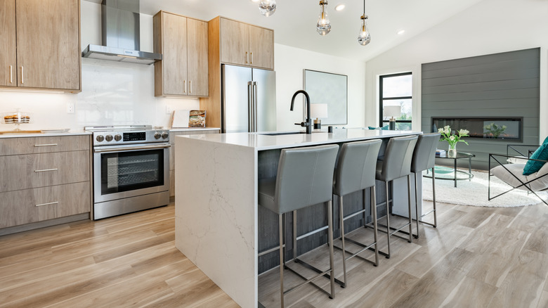 Modern kitchen with a marble kitchen island and seating