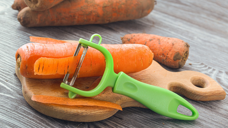 Peeling carrots with vegetable peeler