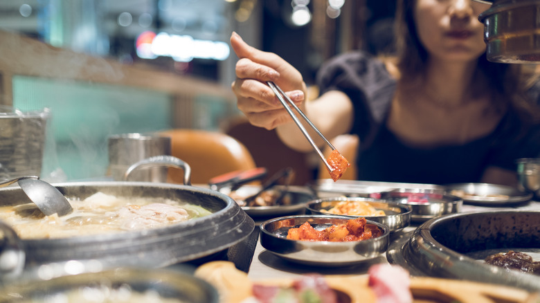 person eating banchan