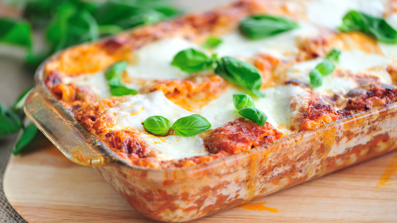 Pan of lasagna with basil on top