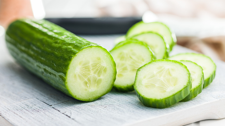 Cucumber cut into slices on a cutting board