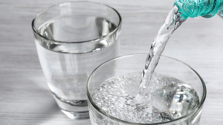 Pouring water into glass