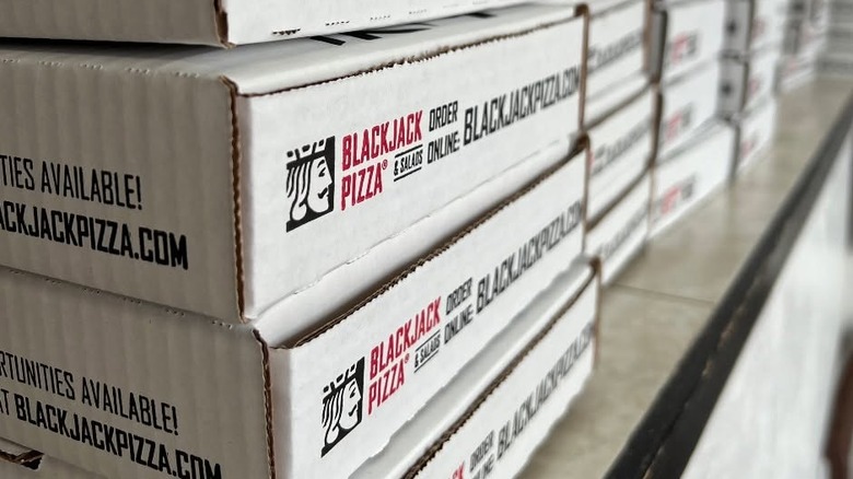 Blackjack Pizza & Salads pizza boxes.