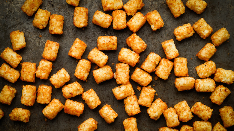 tater tots on a dark grey surface