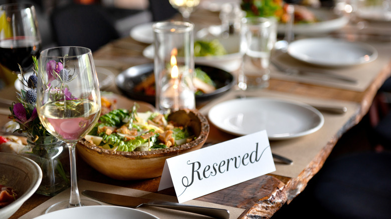 A "Reserved" card on a set dining table