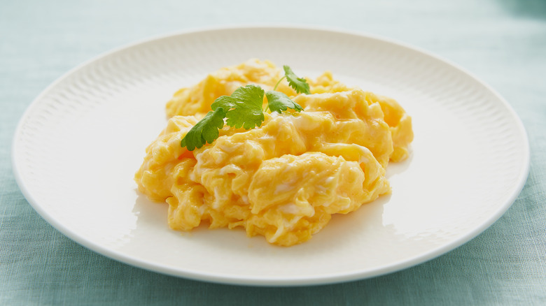 white plate of scrambled eggs