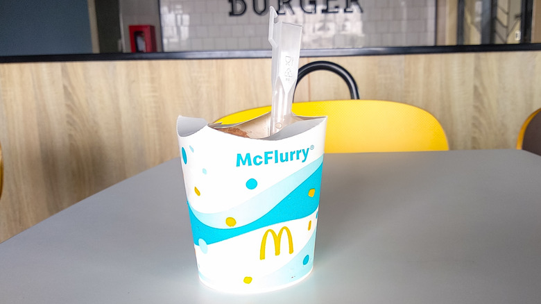 A McDonald's McFlurry sits on a table
