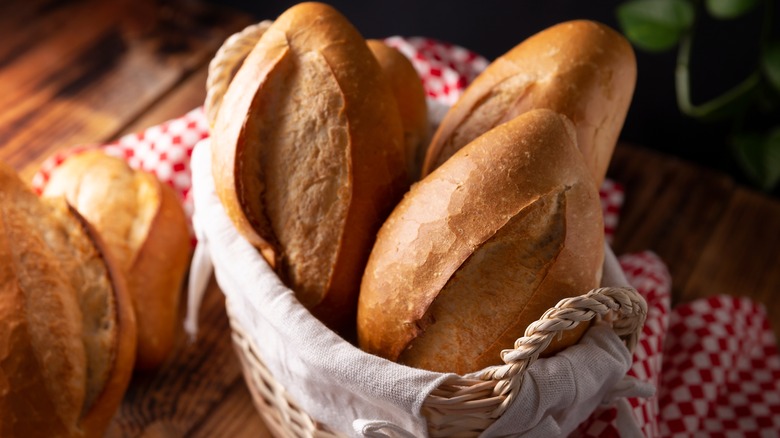 bolillos in basket and on wooden table