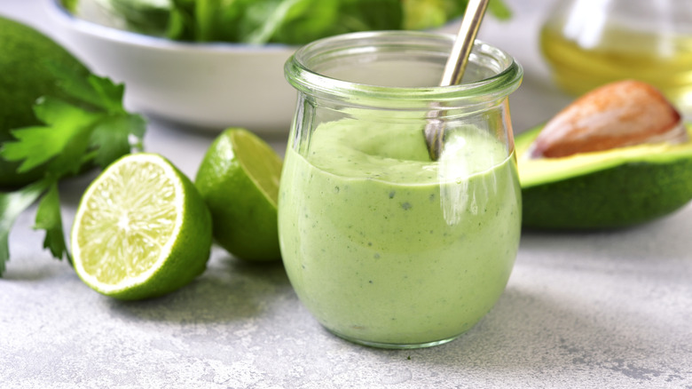 Jar of avocado cream sauce.