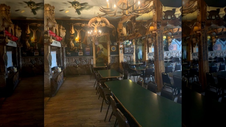 The Antlers interior restaurant with mounted taxidermy and rustic style walls
