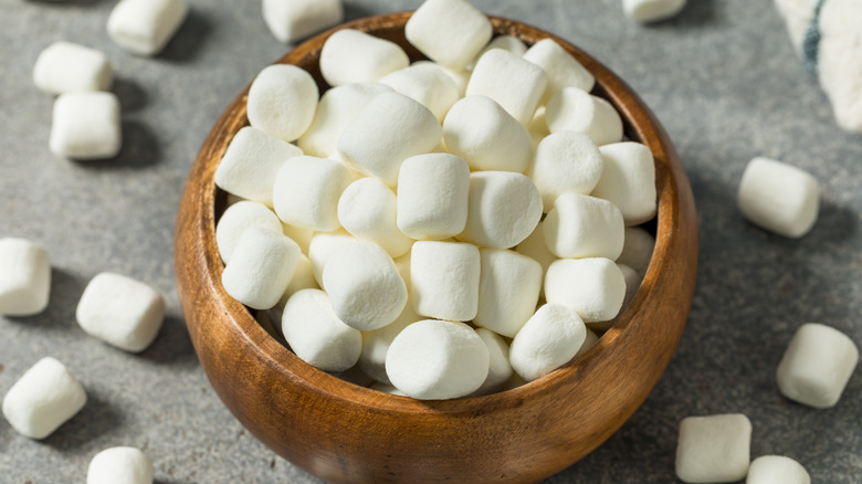 Wooden bowl full of mini marshmallows