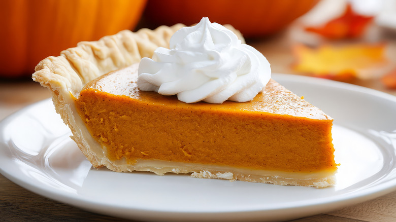 pumpkin pie with whipped cream on top