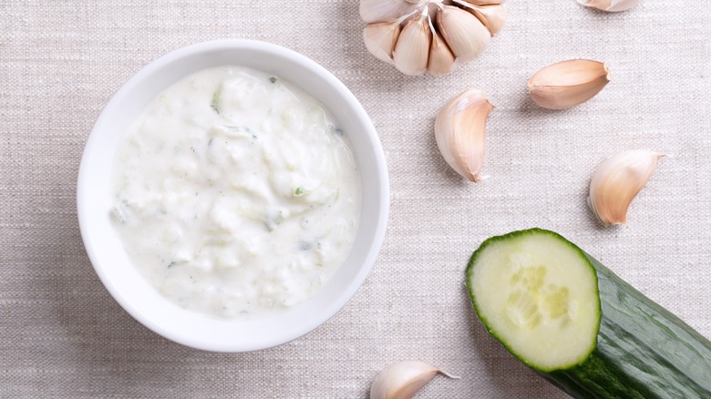 Tzatziki dip with cucumber and garlic on tabletop