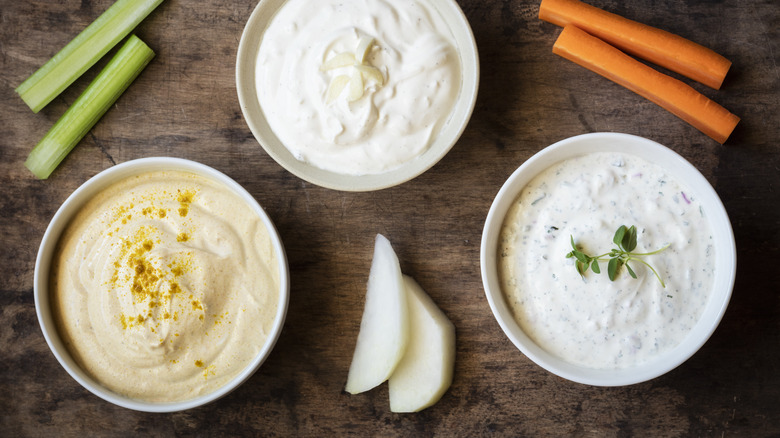 Three creamy dips with raw veggies