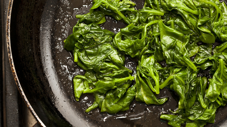 Spinach in a saucepan with liquid